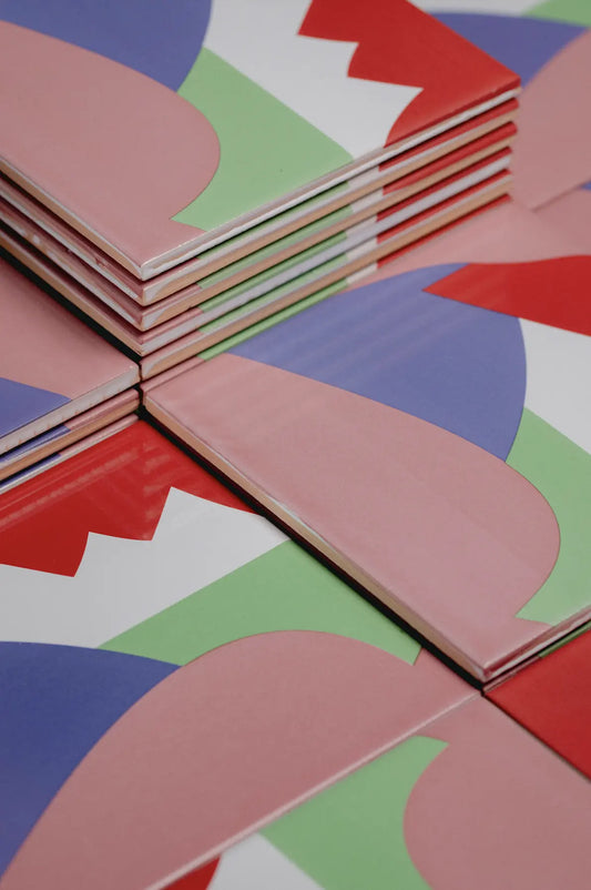 Angled shot of Abstract I ceramic tile by Clay with overlapping geometric shapes – on sale now at Clay