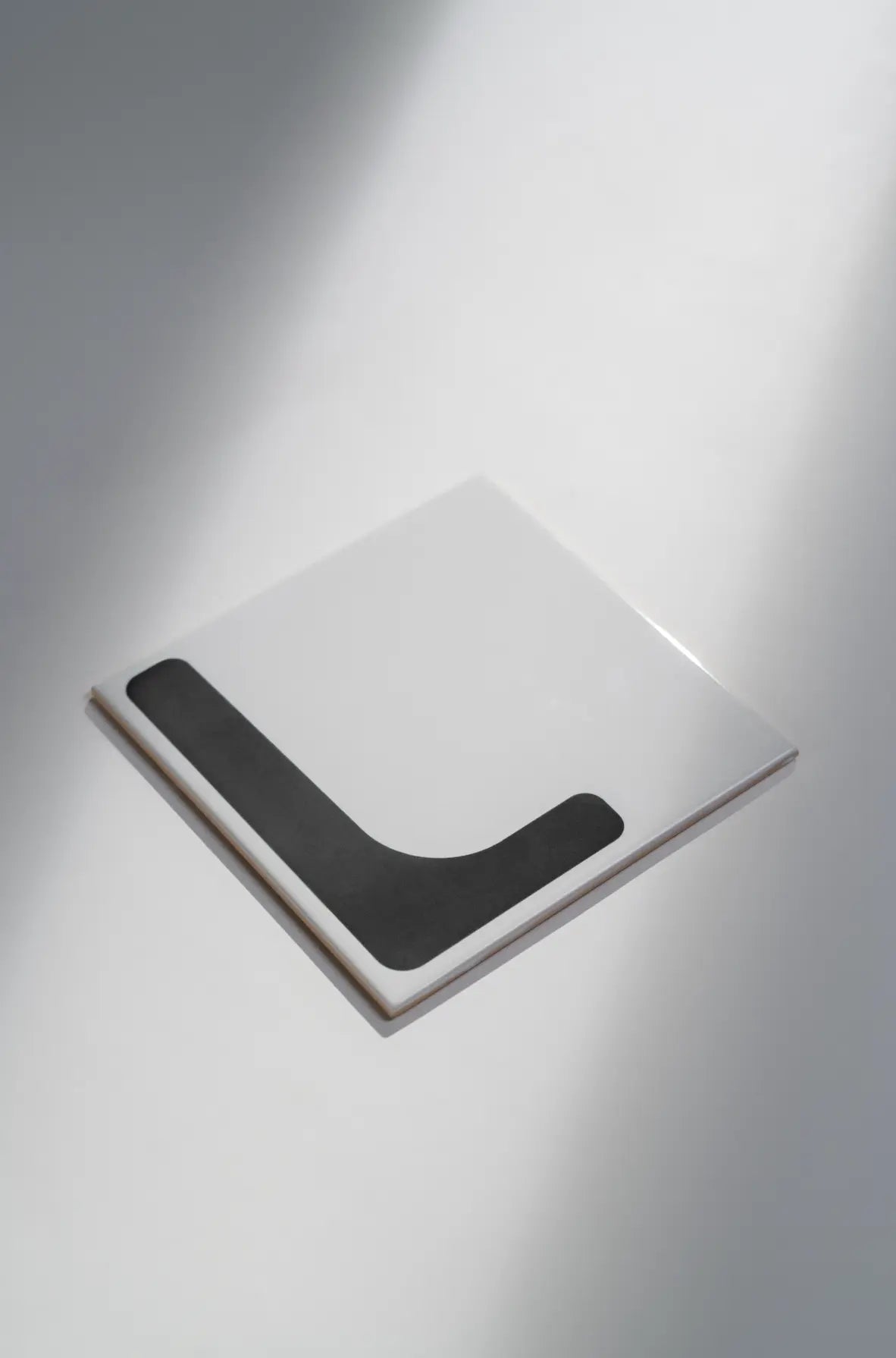 Angled view of Pattern Clay Originals 3 ceramic tile by Clay in black – available exclusively on Clay