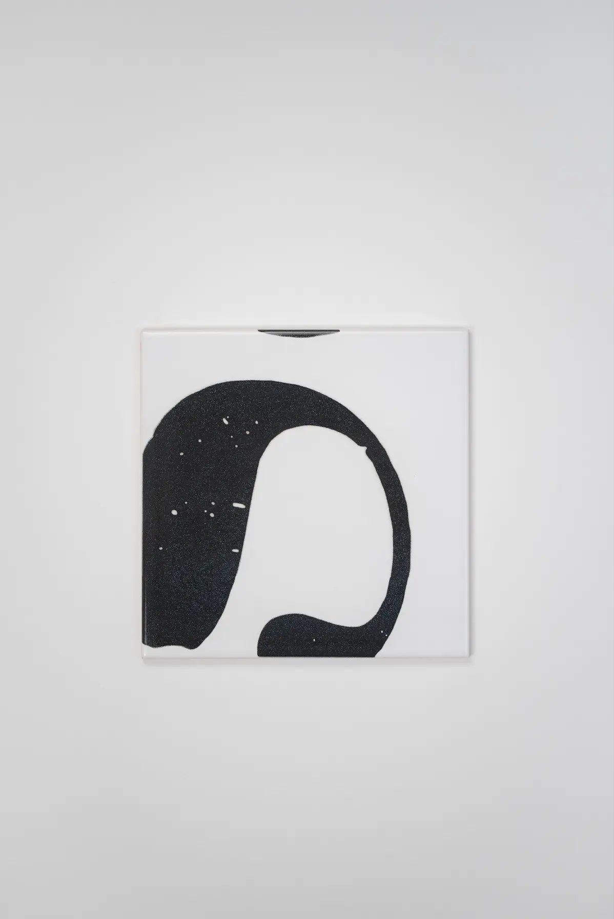 Pattern VHILS ceramic tile by Clay showing bold black letter on white – shop now at Clay